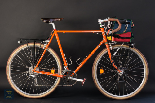 oceanaircycles:Orange Soda Rambler with Harlequin Docena bag modeling in the new studio set up in th