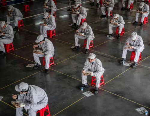 Hubei workers getting back to work. Workers at a Dongfeng Honda factory in Wuhan adhere to social di
