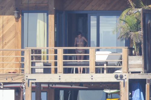 toplessbeachcelebs: Cara Delevingne (Model) sunbathing topless in Malibu (January 2015)