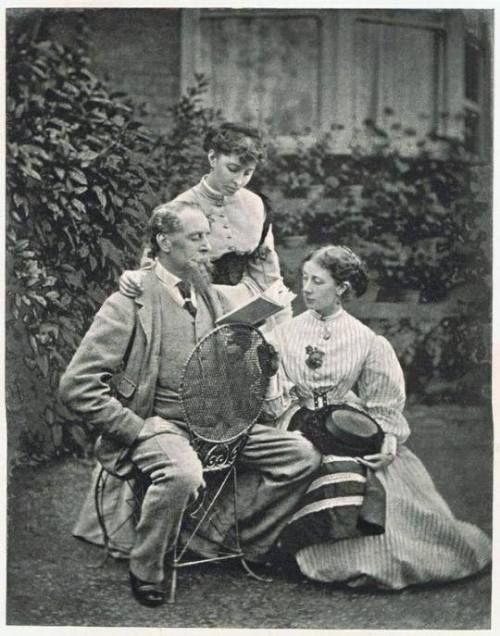 Charles Dickens reading to his two daughters,