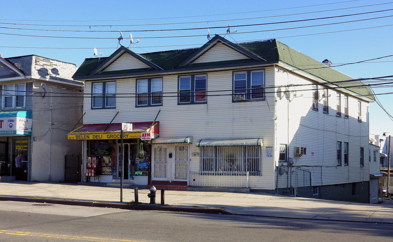 wanderingnewyork:  Attached houses and a storefront in Corona.