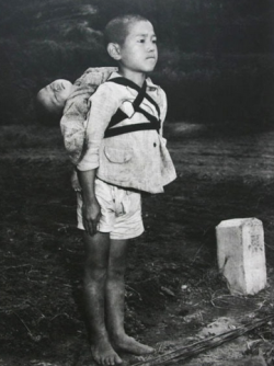 sixpenceee:  THE BROTHERS AT NAGASAKI Probably one of the most intense picture I have ever posted. Extremely depressing content. The photograph above was taken by US Marines photographer Joe O’Donnell shortly after the bombing of Nagasaki. He saw things