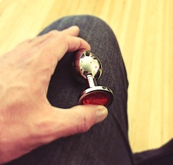 tobeadaddydom:  I love this little toy–I love the cold, smooth weight of the metal and the shimmer of the red jewel on the end. I savor the moment when I slowly–with lots of lube–push it in her beautiful little asshole and the way she submits to