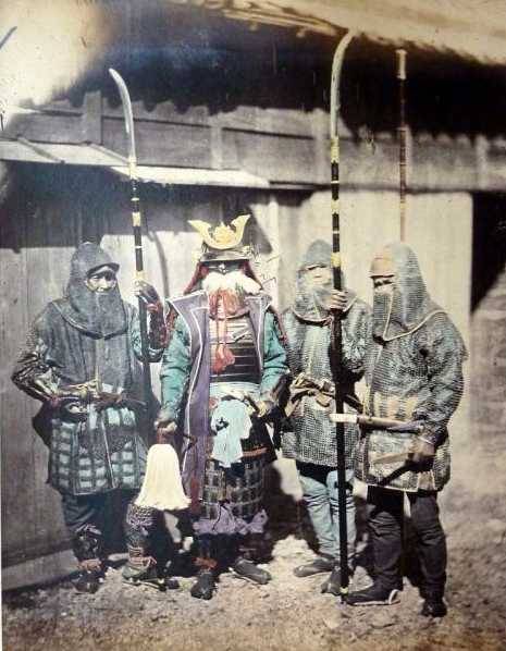 historicaltimes:  A Rare Photo of a Japanese Samurai with his Retainers wearing who are wearing Kusa