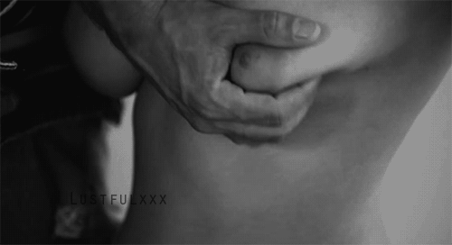 Roughly kneading one of your lovely breasts. Squeezing. Pinching. Arousing.
