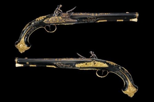 An exceptional pair of flintlock pistols signed “Loius Lamotte, A St. Ettiene”.  Circa 1