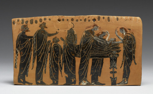 Black-figure terracotta pinax (plaque) showing a scene of prothesis, in which a deceased person is l