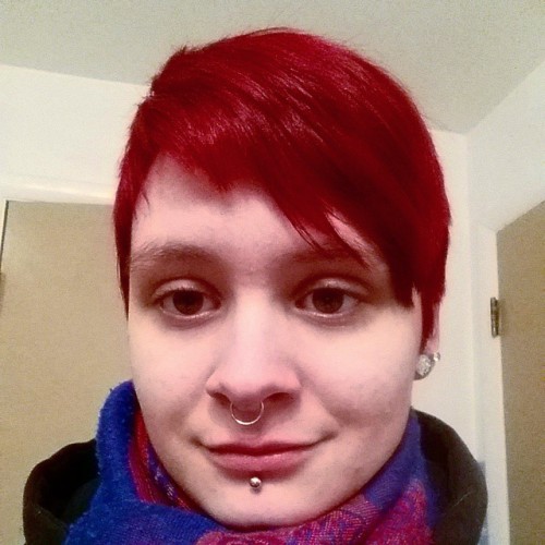 Also my hair is red and a pixie now