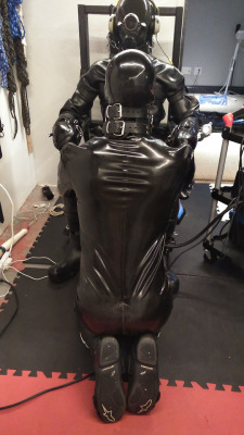 rubbertopboys:  A new Drone Major…being programmed, with the help of a rubber gimp!
