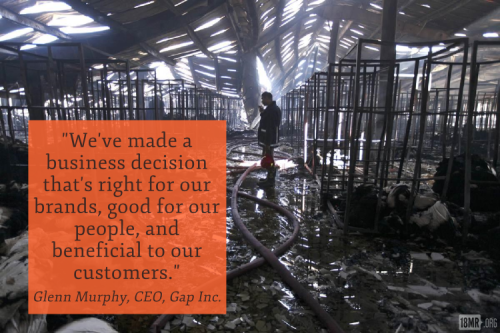 A firefighter stands in the burnt wreckage of the Aswad Composite Mills factory in October 2013. Gap