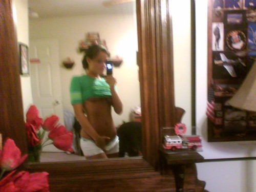 mymarinemindpart2:  An Air Force girl posing (There is an air force poster in the mirror shot) 