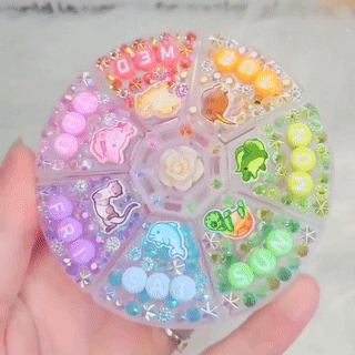 someone holding a colorful decorated medicine case