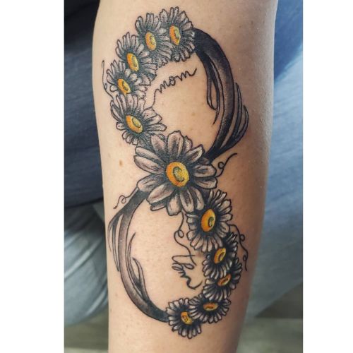 <p>Daisies with infinity symbol done today.  Thanks for coming in today, it was great working with you again! ❤<br/>
.<br/>
#ladytattooer #thephoenix #copperphoenix #shelbyvilleindiana #indianapolistattoo #indylocal #do317 #indytattoo #circlecity #waverlycolorco #blackandgrey #blackandgreytattoo #blackandgray #blackandgraytattoo #daisies #floraltattoo #infinity #memorialtattoo  (at Shelbyville, Indiana)<br/>
<a href="https://www.instagram.com/p/CIOiNoggXo3/?igshid=vafixp9tb1k8">https://www.instagram.com/p/CIOiNoggXo3/?igshid=vafixp9tb1k8</a></p>