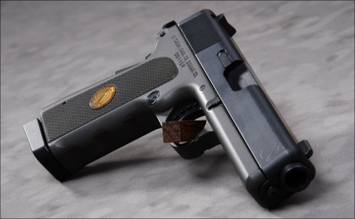 gunrunnerhell:  Alchemy Arms Spectre If a Glock and 1911 were to get into a fight then have make-up sex, the love child born from that tryst would be the Alchemy Arms Spectre. The pistol, which was chambered in .45 ACP or .40 S&W is based on the