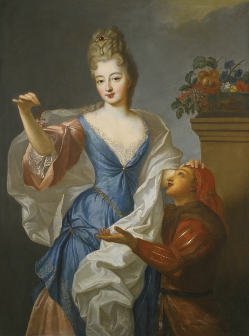 Portrait of a lady with her jester, three-quarter length, wearing a blue dress and holding a sprig o