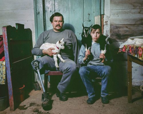 “Aleksandr Konokov and Sasha on their Goat Farm in Desiatyny, Zhytomyr region,” 2017, fr