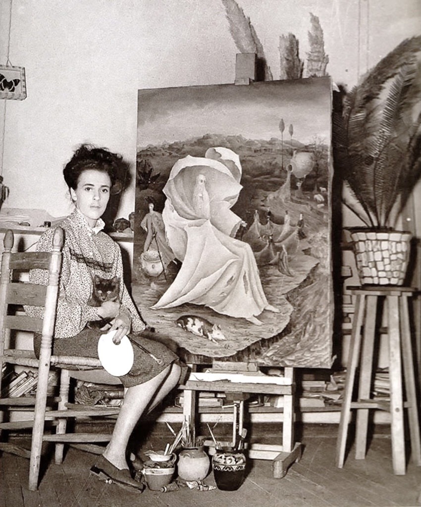 painters-in-color:  Surrealist painter Leonora Carrington sitting next to her painting “The Temptation of St. Anthony” 1945  https://painted-face.com/