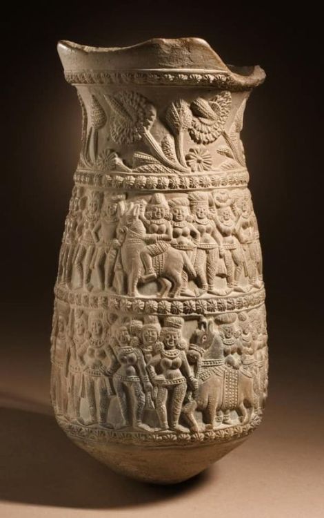 A Woman riding a horse in a Processional scene depicted on a vase from West Bengal(Chandraketugarh),