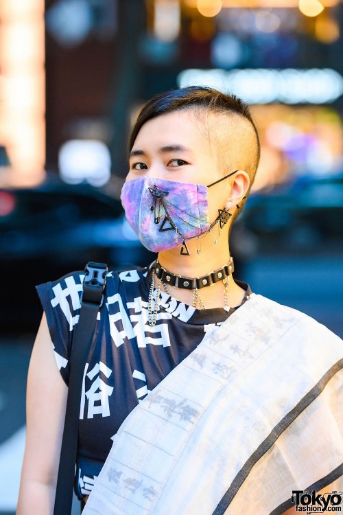 Japanese PHD neuroscience student Yoritam (she/they) on the street in Harajuku wearing a kanji print