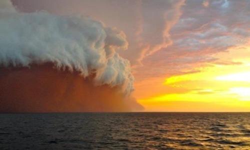 Taken by a tug boat worker in West Australia, Brett Martin has captured the moment a huge storm met 