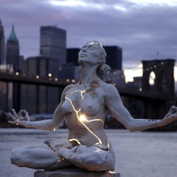 red-lipstick:Paige Bradley (b. Carmel, CA, USA) - Expansion, 2004     Sculpture: Bronze, Lighting.  Originally photographed in 2004 against a Manhattan skyline.