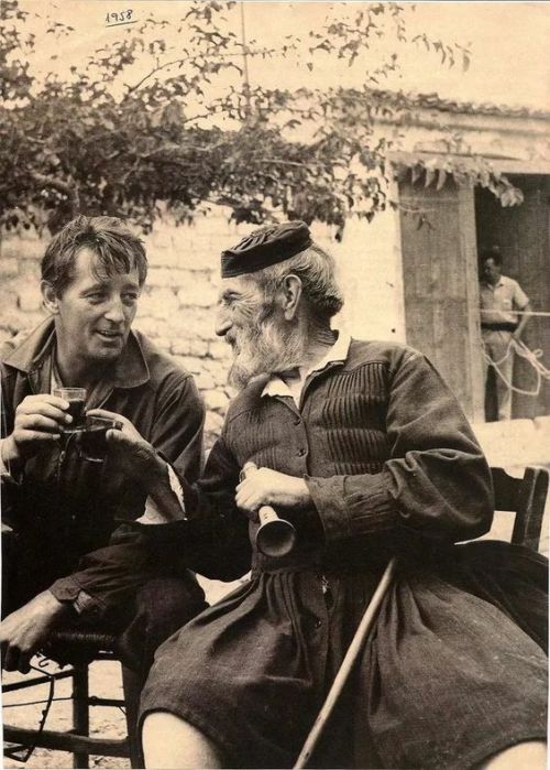 Robert Mitchum, drinking with his Greek friend Tselepis, in Arahova, a mountain village near Athens,