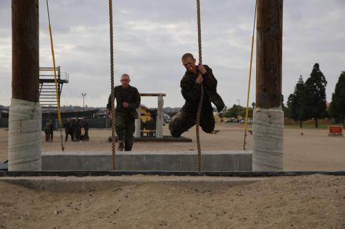 ceebee23: Marine Corps Recruit Depot - Recruits climb their way up and over a wall while running the
