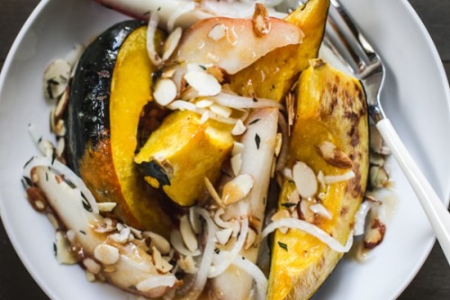 food52:  Not your average squash. Roasted Acorn Squash with Pears and Miso Dressing via Edible Perspective.