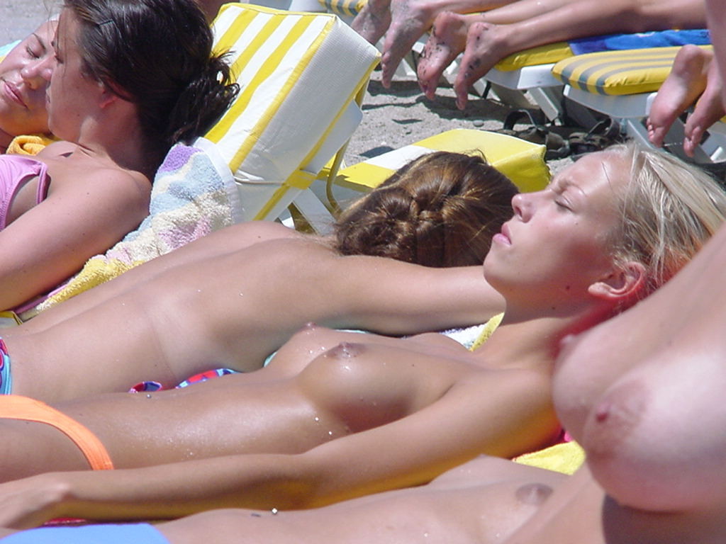 Topless beach girls