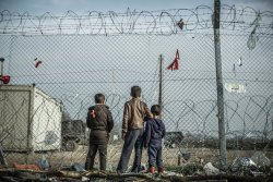 Troposphera:  Idomeni, Greece Three Boys In The Idomeni Refugee Camp Wait For The