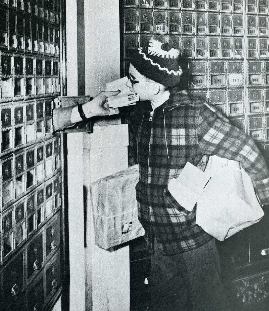 Already loaded down with packages, ten-year-old Philip Laffin of Ellsworth, Maine,