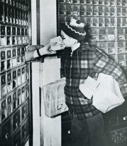 Already loaded down with packages, ten-year-old Philip Laffin of Ellsworth, Maine, gets oral free delivery for the letters.