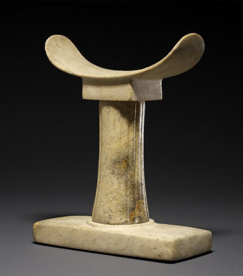 Ancient Egyptian head-rest (c. 2300 BC, during the Old Kingdom).  It is made of calcite, also k