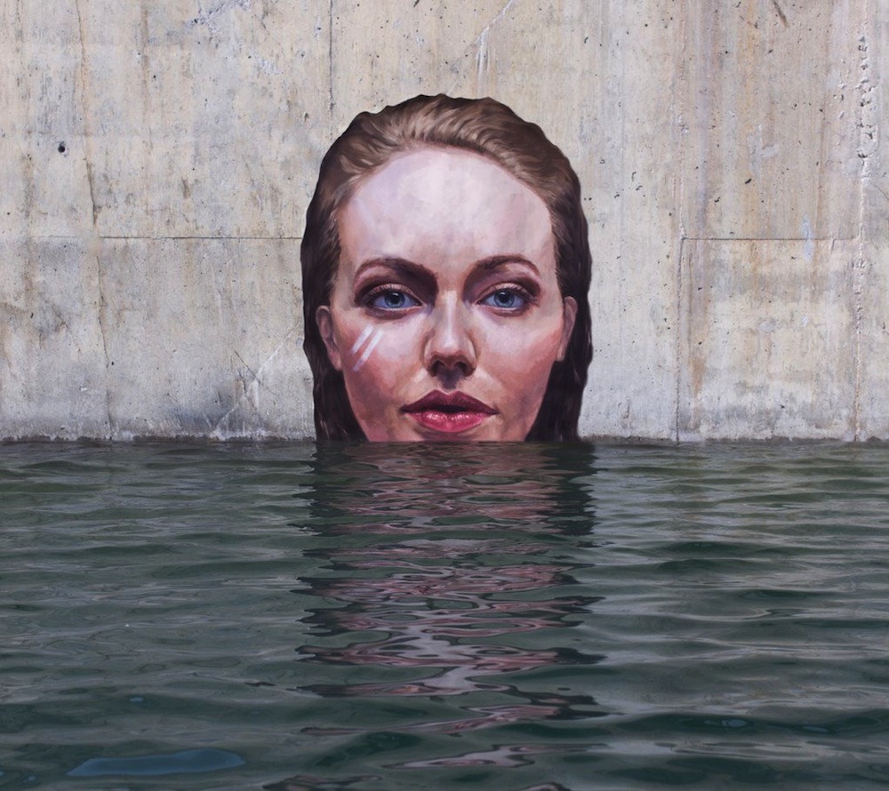itscolossal:  Artist Sean Yoro Paints Meticulous Seaside Murals While Balancing on