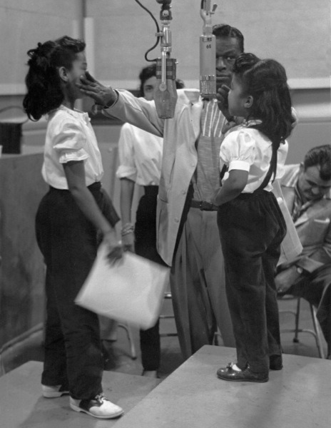twixnmix:    Nat King Cole with his daughters Carole and Natalie during a Capitol recording session circa 1955.