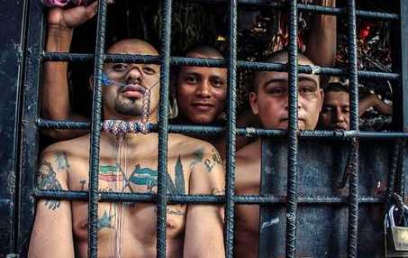 sixpenceee:  Overcrowded Prison in El Salvador Shocking new images have been released of the El Salvador prisons where gang members are held for years in cramped, diseased pits. Although the cells are only designed for a maximum stay of 72-hours, many