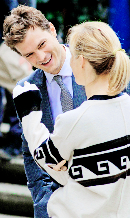 fiftyshadesofgreyinspiration:    Jamie Dornan and Sam Taylor Johnson -  Fifty Shades of Grey reshoots  source:jamie-dornan.org   I love his smile, my smail.