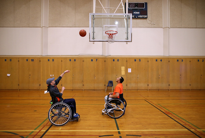 Two disabled veterans play basketball during day two of the inaugural Valor Games Far West in San Mateo, Calif. Dozens of disabled and wounded military veterans are participating in the games which are intended to introduce adapted sports to...