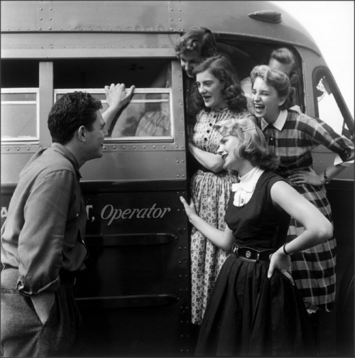 Young man holds audience with a group of pretty young girls, Port Jefferson High School, 1955Photo:E