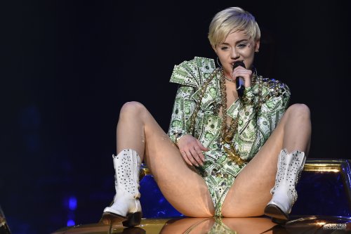 pornwhoresandcelebsluts:  Miley Cyrus does more slutty spread leg crotch shots live in concert on the Bangerz tour