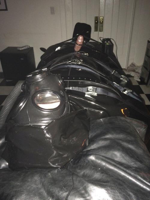 dutchguy2-0: rubberkai: rubberelectropoppers: Fully rubberized subject needed a strapped down sackin
