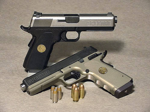 gunrunnerhell:  Alchemy Arms Spectre If a Glock and 1911 were to get into a fight then have make-up sex, the love child born from that tryst would be the Alchemy Arms Spectre. The pistol, which was chambered in .45 ACP or .40 S&W is based on the
