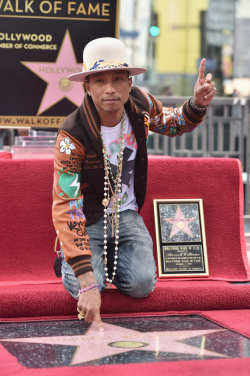ssngx:  daily—celebs:  12/4/14 - Pharrell Williams receiving a star on The Hollywood Walk of Fame.