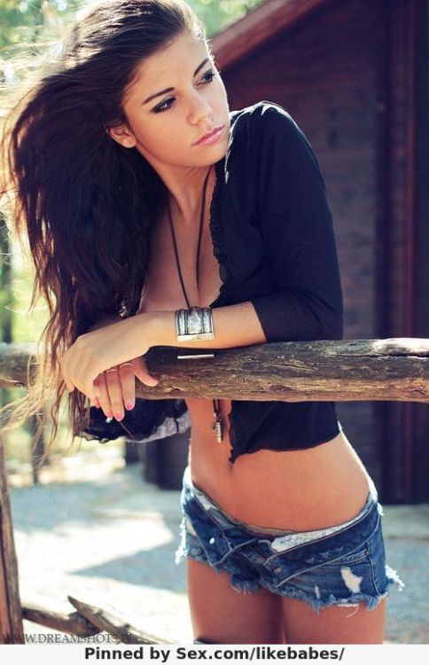 pretty young brunette in cutoff jeans