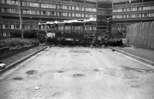 oglaighnaheireann: A burnt out bus blocking an access road to the Divis flats in Belfast. The flats 