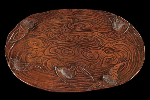 japaneseaesthetics:  Tray in an ovoid cloud-like form carved in relief with a design of five bats flying around swirling abstract clouds. Of carved keiyaki (zelkova) wood, the bats’ eyes inlaid in ebony. Signed on the reverse with a large carved seal-form