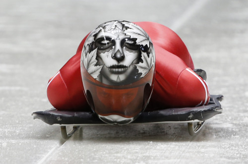 thiscaledonianlife:  Sarah Reid of Canada makes a practice skeleton run ahead of the Sochi 2014 Winter Olympics at the Sanki Sliding Center, on February 5, 2014. (Alex Livesey/Getty Images) (Murad Sezer/Reuters) 