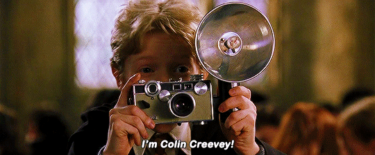 Colin Creevey takes a photograph of Harry Potter