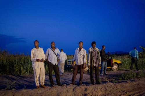 Muslim men take a taxi from the IDP camp in Bangui after the evening prayer to go to the bus station