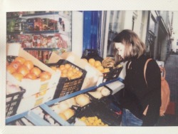 space-beam:  polaroids of sunny days in December: me at lil fruitmarkets and i took the other one of my friend jumping in a puddle hihaho 